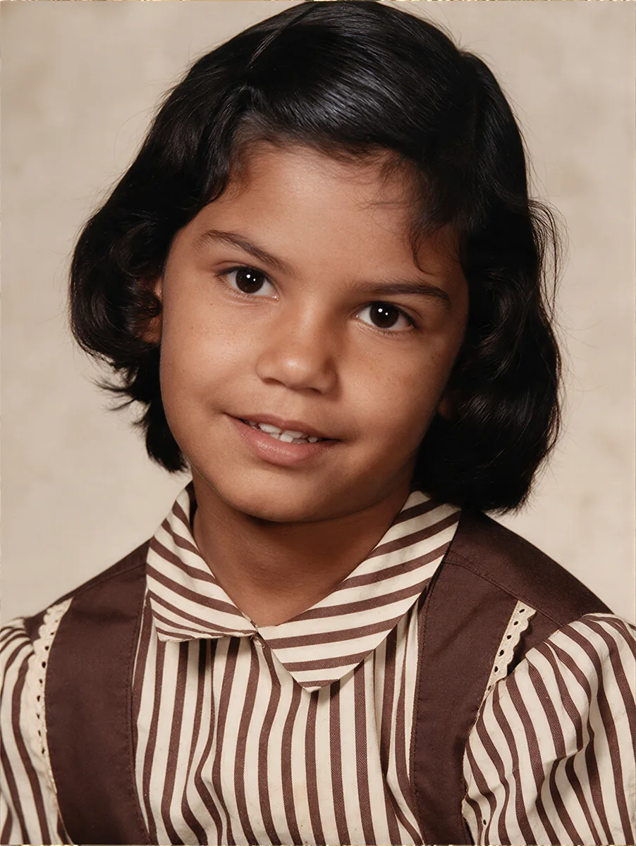 Creased faded child portrait restored to colour by Radbin — after